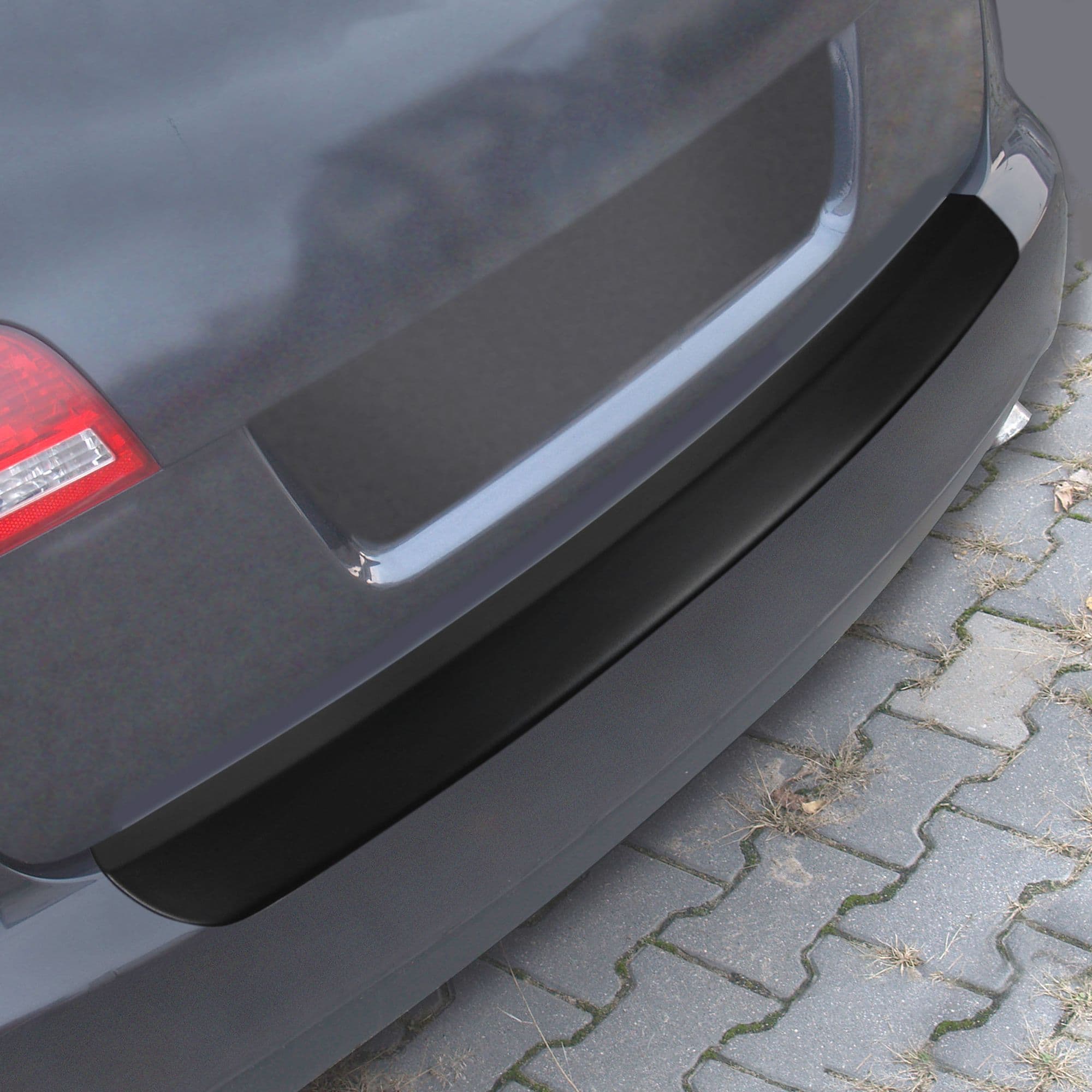 Rear bumper trim — Black, ABS plastic, Matte