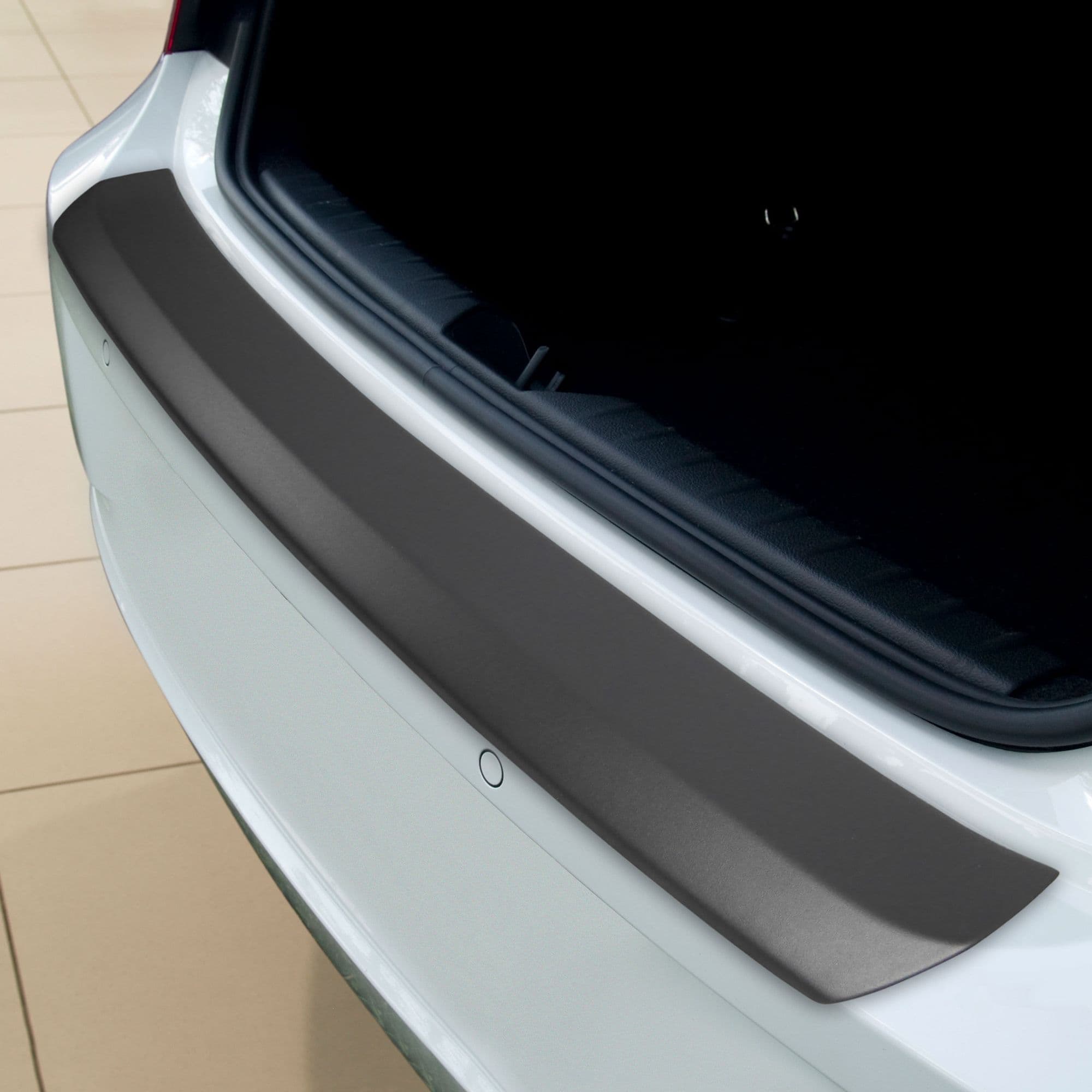 Rear bumper trim — Black, ABS plastic, Matte