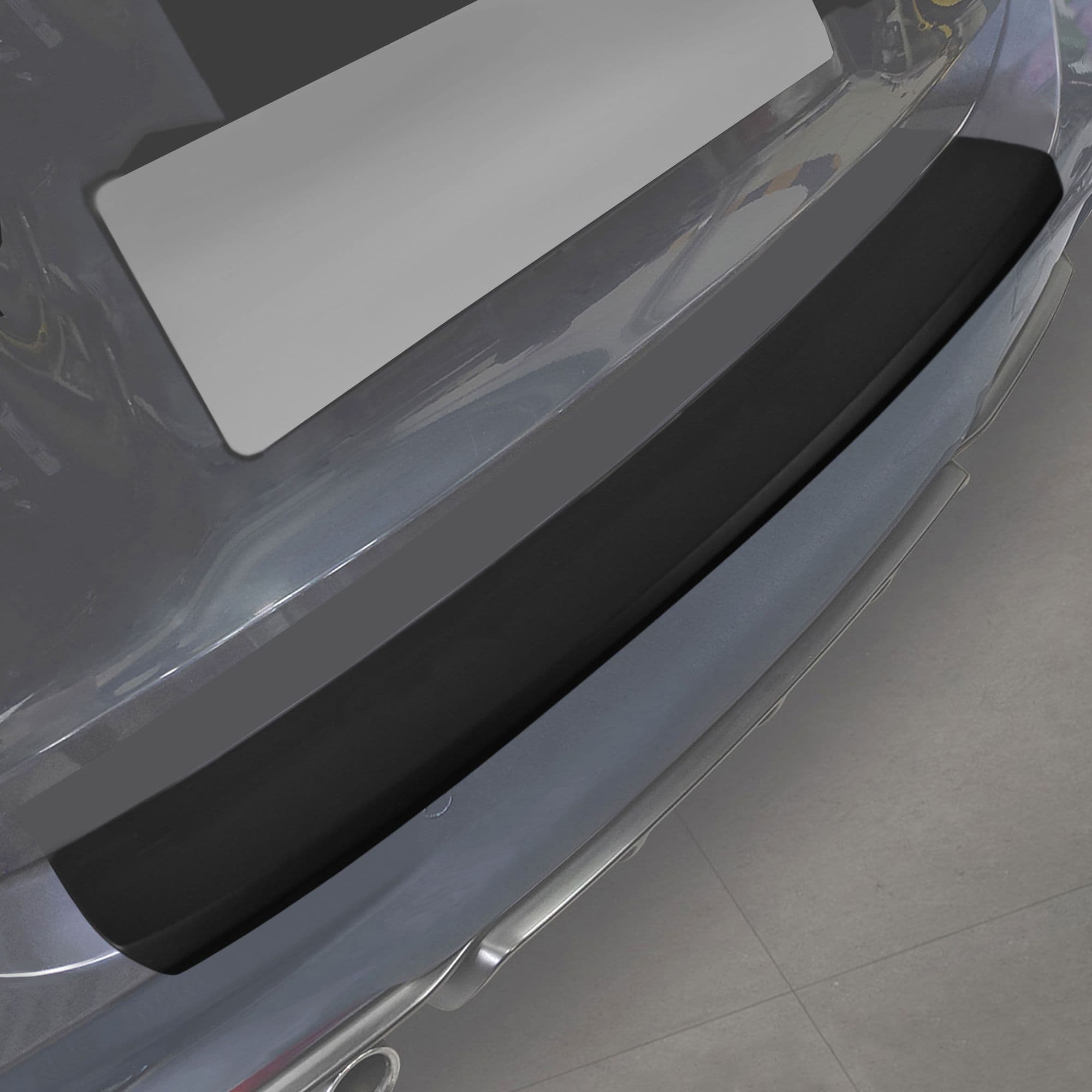 Rear bumper trim — Black, ABS plastic, Matte