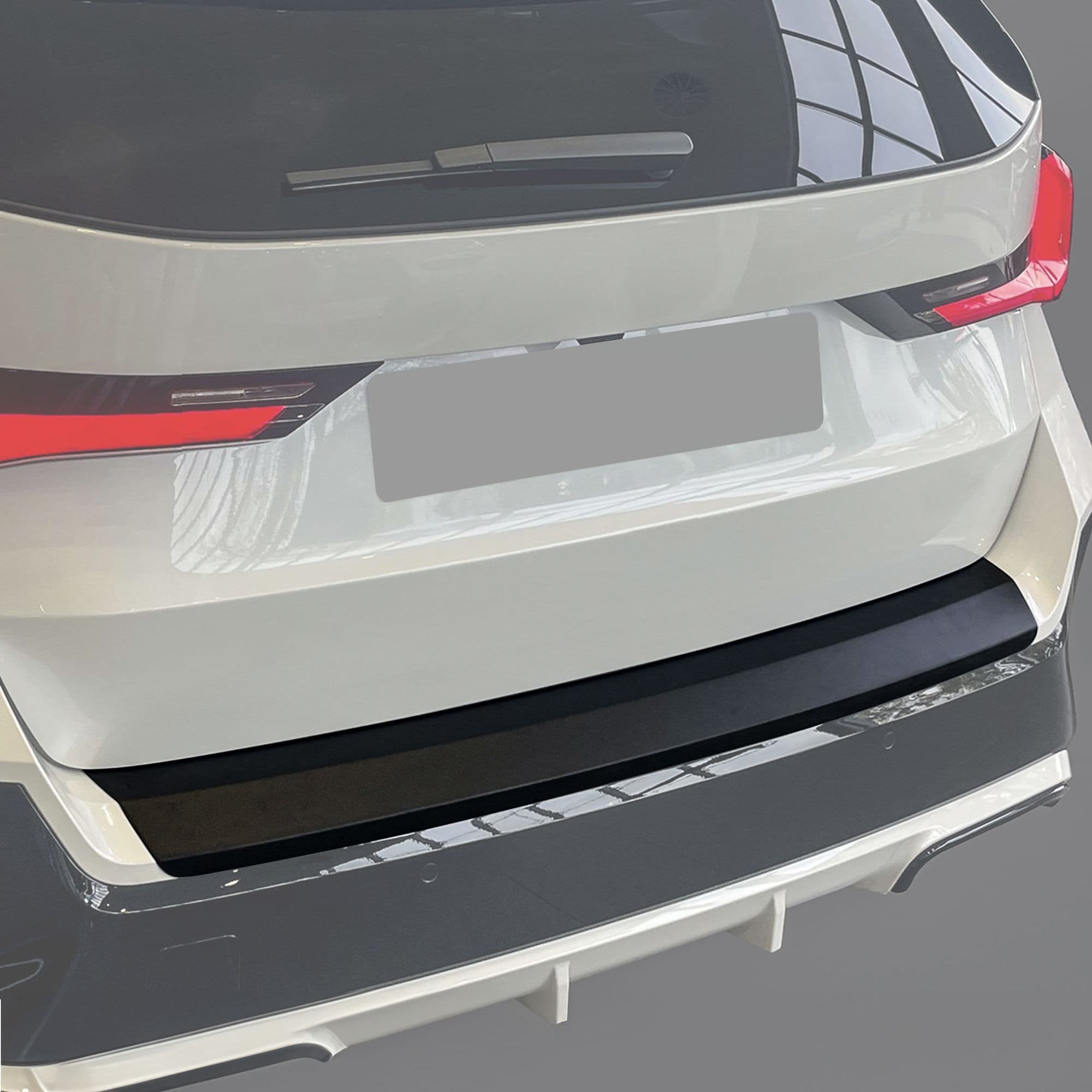 Rear bumper trim — Black, ABS plastic, Matte